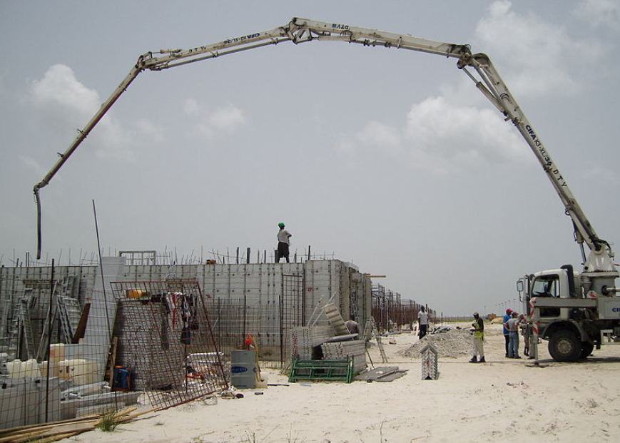 this image of a crane concrete pumping in bakersfield california